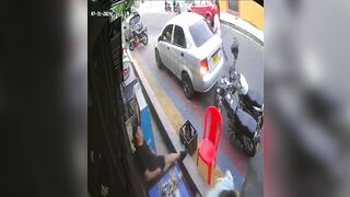 Colombia: Man sitting Relaxingh with Nervous Friend is Brutally Executed