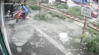 Wow: Man Drives onto Train Tracks on his own Front Yard....and just Stops