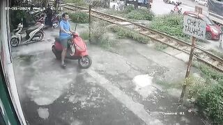 Wow: Man Drives onto Train Tracks on his own Front Yard....and just Stops