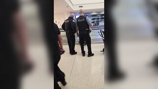 Woman Seen Yelling at Police Before Being Wheeled Away at Midway Airport