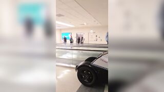 Woman Seen Yelling at Police Before Being Wheeled Away at Midway Airport