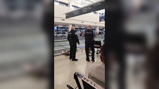 Woman Seen Yelling at Police Before Being Wheeled Away at Midway Airport