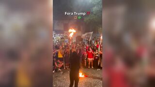 Brazilian activist set an American flag on fire to protest Trump support of Bolsonaro