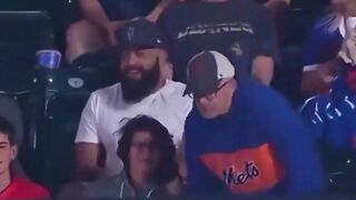 Guy rips a baseball from an elderly man’s hands