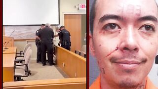 Man CARRIED into court after allegedly murdering his father and stepmother.
