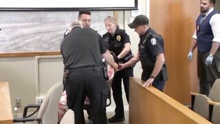 Kid accused of Killing his Parents carried like a baby into courtrom