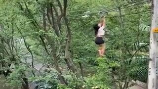 Girl climbs to grab some sneakers from the cables and falls hitting a tree (What a blow she took )