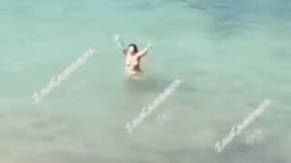 Topless Possessed Woman in Ibiza Beach Barks at Cops among Other Crazy Things
