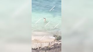 Topless Possessed Woman in Ibiza Beach Barks at Cops among Other Crazy Things