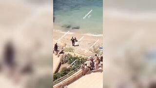 Topless Possessed Woman in Ibiza Beach Barks at Cops among Other Crazy Things