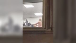 Busty Woman can be seen having Sex inside the office in full view window by passerby