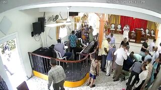 And the Band Played On..Crazy Man enters Church and starts Stabbing. Watch the Organ Player