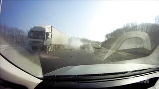 Toyota crushed between a Truck and a Trailer after a Failed Overtaking [Russia, February 11]