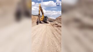 WARNING: To Avoid Near Decapitation Don't Try to Stop an Out of Control Excavator