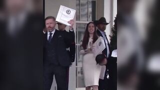 group of Journalists leave the White House holding Phase 1 of the Epstein file