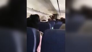 Black Woman Runs Around Southwest Plane Completely Demanding to be let off.