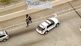Following a traffic accident a woman gets out and stabs the driver of the other car