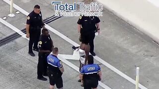 Following a traffic accident a woman gets out and stabs the driver of the other car