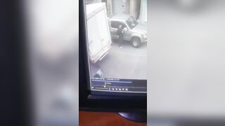 Woman Trips and Falls under Truck (Slo Mo)