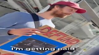 BREAKING: DOGE Protester Outside the Tesla Store Admits he was Paid to Protest. "I get paid to be out here."