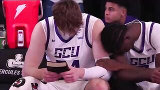 POWERFUL: Duke Brennan Holds the Bible and Prays Pregame, Teammate Tyon Grant-Foster Reaches over to Pray with him.