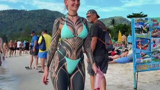 Girl Spent a LOT on Tattoo's to have this Glorious Moment on the Beach