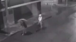 A woman is killed by a hitman on a bicycle (He hit her in the head