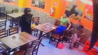 Two female employees are shot in a restaurant after failing to pay extortion