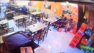 Two female employees are shot in a restaurant after failing to pay extortion