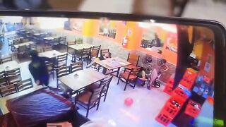 Two female employees are shot in a restaurant after failing to pay extortion
