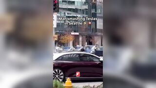 Guy Smashing Tesla's..Second Victim tries to Console?