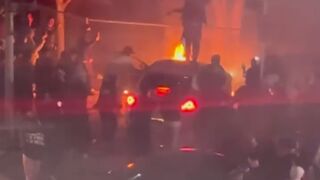 Driver is seen discarding a Stolen Infiniti into a fire pit at a sideshow in Los Angeles, California