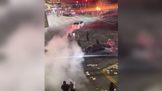 Driver is seen discarding a Stolen Infiniti into a fire pit at a sideshow in Los Angeles, California
