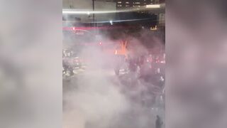 Driver is seen discarding a Stolen Infiniti into a fire pit at a sideshow in Los Angeles, California