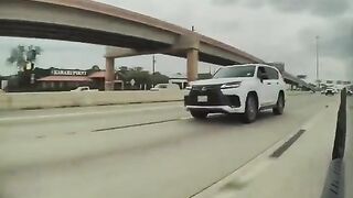 Left Wing Lunatic Tries to Run a Cybertruck off the Road Then Pulls What Appears to Be a Gun in Broad Daylight.