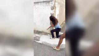 A woman who went viral for beating a high school student in the street was arrested.