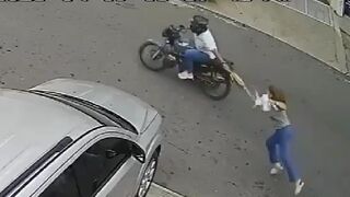 Two Angles and Slow Motion of Woman who Held onto Her Purse