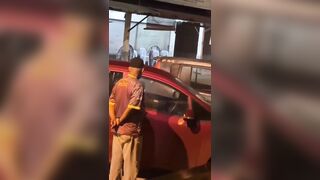 Couple doesn't even know people are watching them..Until a knock at their window..lol