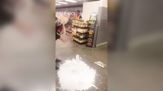 Los Angeles, California.— Woman puts milk on her face after she was Maced by security during an altercation at Food 4 Less