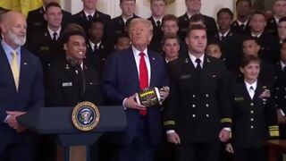 Navy Team presents Trump with Football.