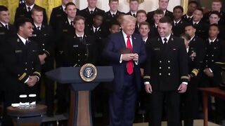 Navy Team presents Trump with Football.