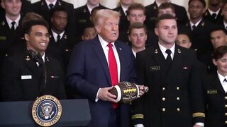 Navy Team presents Trump with Football.