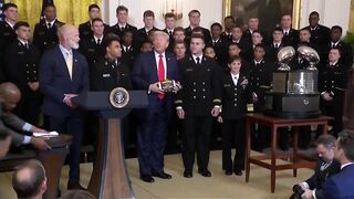 Navy Team presents Trump with Football.