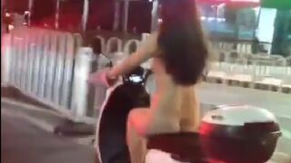 Woman in China Strips Naked and Leisurely Rides her Bike