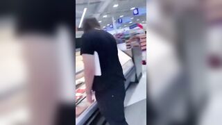 How Sad: Vegan activists pay homage to the fallen at the meat counter.