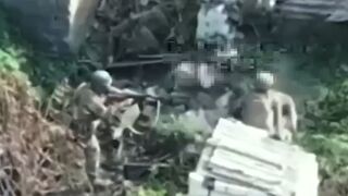 A drone filmed a captured Ukrainian soldier attempting to take weapons from Russian soldiers