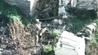 A drone filmed a captured Ukrainian soldier attempting to take weapons from Russian soldiers