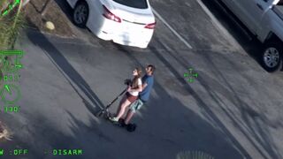 Man's Girlfriend attempts to Flee on a Scooter as He is Arrested lol