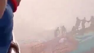 The final seconds of life of a group of people can be seen.