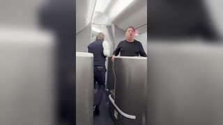Elderly Woman Tries to Storm American Airlines Cockpit before being Stopped by Everyone